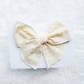 Fable Bow on Clip• Yellow Swiss Dot